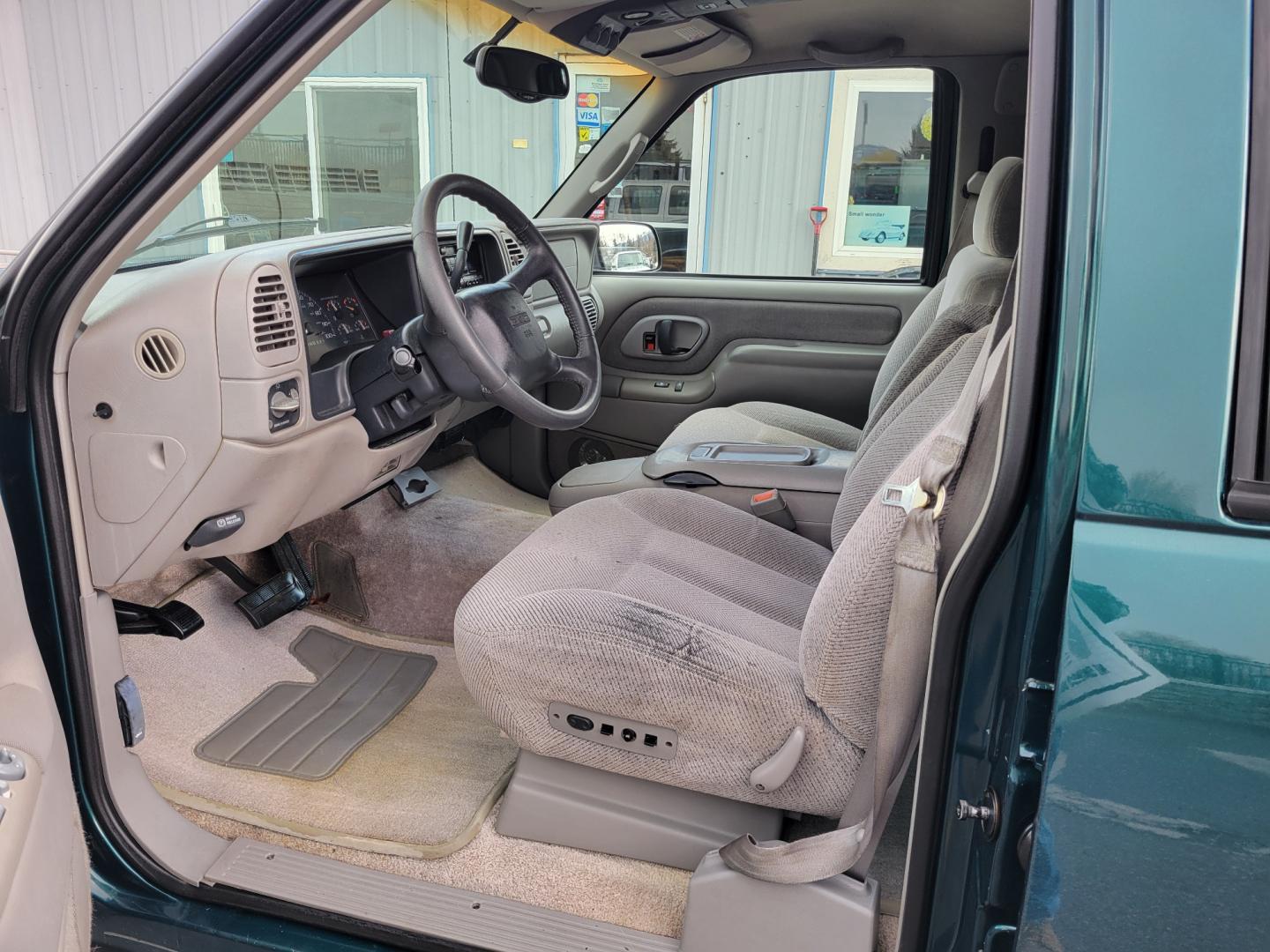 1998 Green /Gray GMC Suburban SLE (3GKFK16R9WG) with an 5.7L V8 engine, 4 Speed Auto transmission, located at 450 N Russell, Missoula, MT, 59801, (406) 543-6600, 46.874496, -114.017433 - 4WD SUV. 5.7L V8 Engine. 4 Speed Automatic Overdrive Transmission. Front and Rear Climate Control. AM FM CD Cassette. Air Cruise. Tilt. Power Front Seats. Power Windows and Locks. Towing. Running Boards. 3rd Row Seating. Because of the Age, financing is not available on this vehicle. - Photo#8